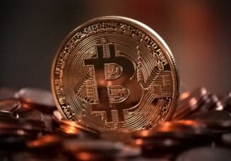 Bitcoin a depășit prețul de 48 de mii de dolari